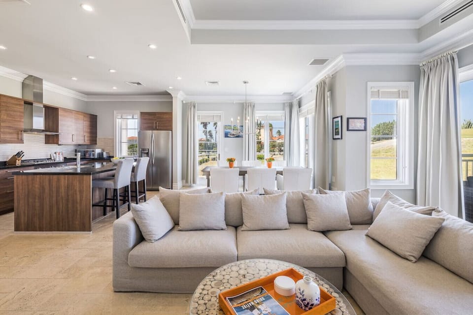 An inviting and spacious living area, designed for both relaxation and entertainment, with stunning views that extend to the outdoors.