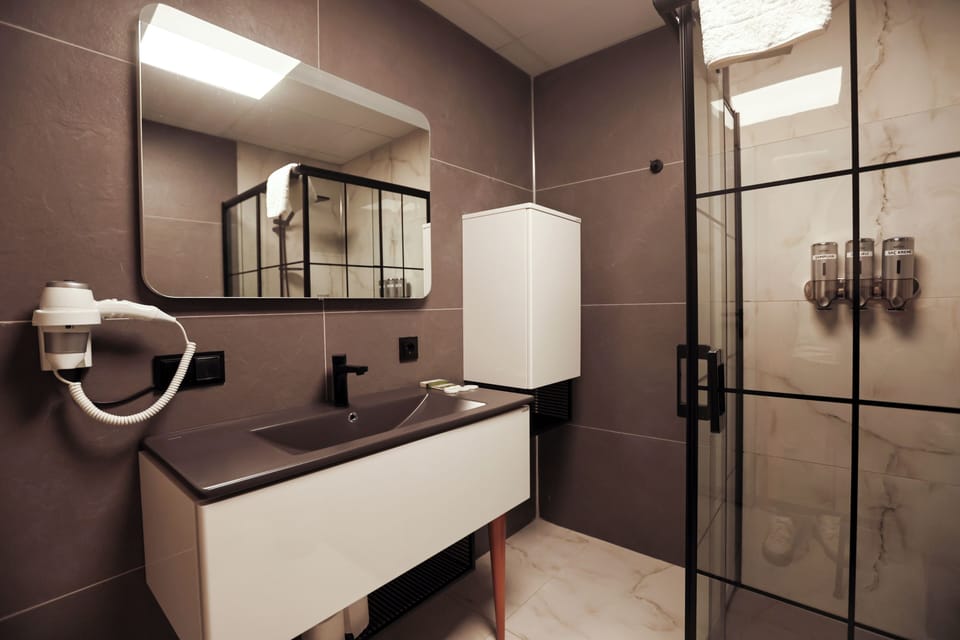 Family Double Room, 1 Bedroom, Balcony, Sea View | Bathroom | Shower, hair dryer, slippers, towels
