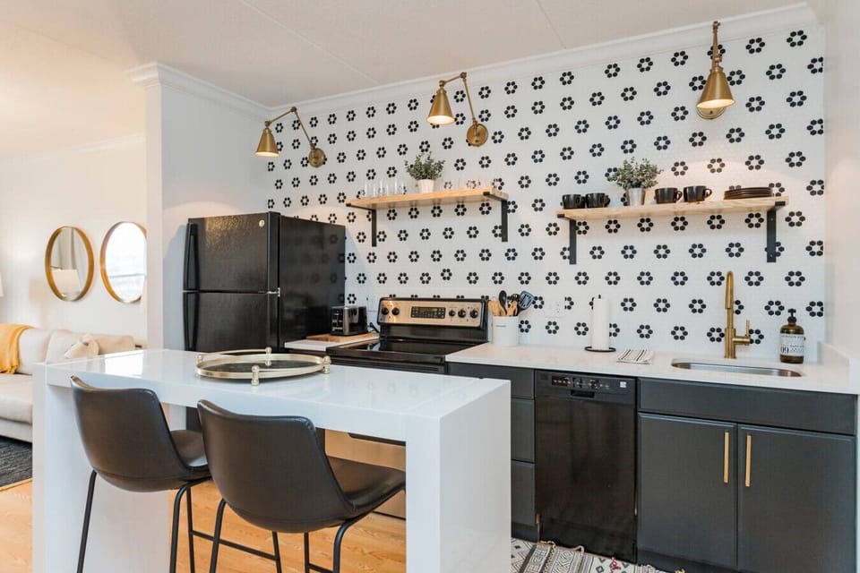 Unit 1 - Fully-stocked, updated kitchen with all cooking essentials, seating for 2 at the counter and separate room with a coffee bar.