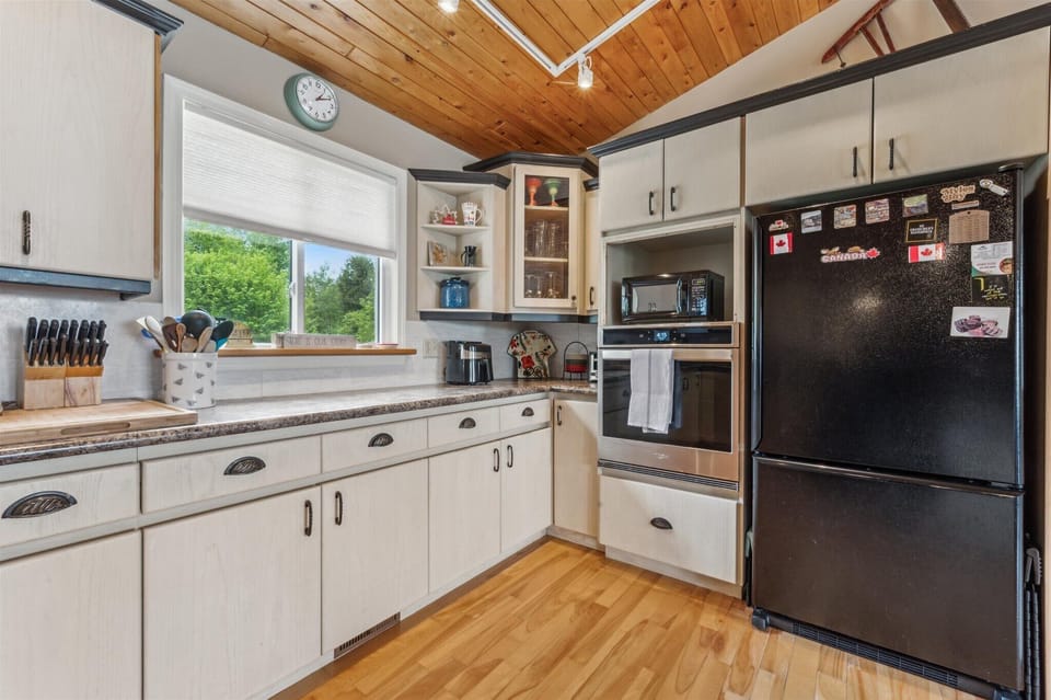 Spacious countertops and modern appliances make cooking here a breeze, with natural light streaming in through the window.