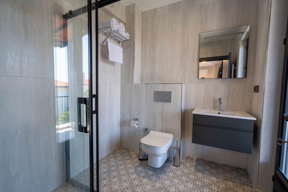 Deluxe Double Room, Terrace, Sea View | Bathroom | Shower, hair dryer, slippers, towels