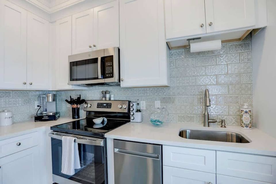 This kitchen has all the amenities of a modern home neatly designed to fit  this historic home.