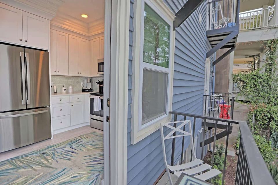Outside the kitchen is a snug little balcony. Perfect for enjoying the outdoors from the comfort of this home.