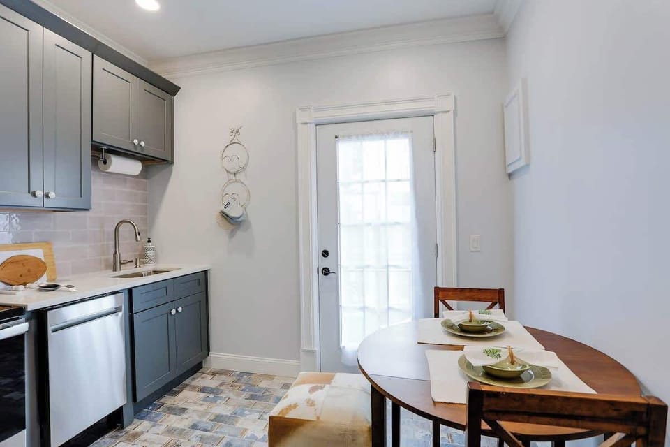 A cozy dining nook completes this bright kitchen. 