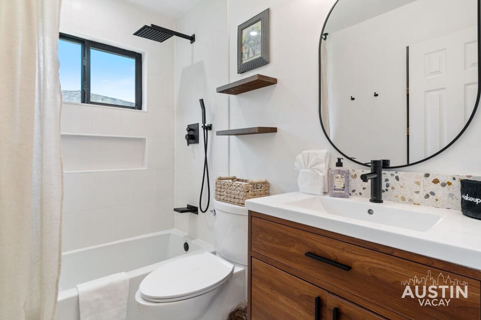 Shared never looked this chic. Crisp white style and a rainshower that brings the spa to you.