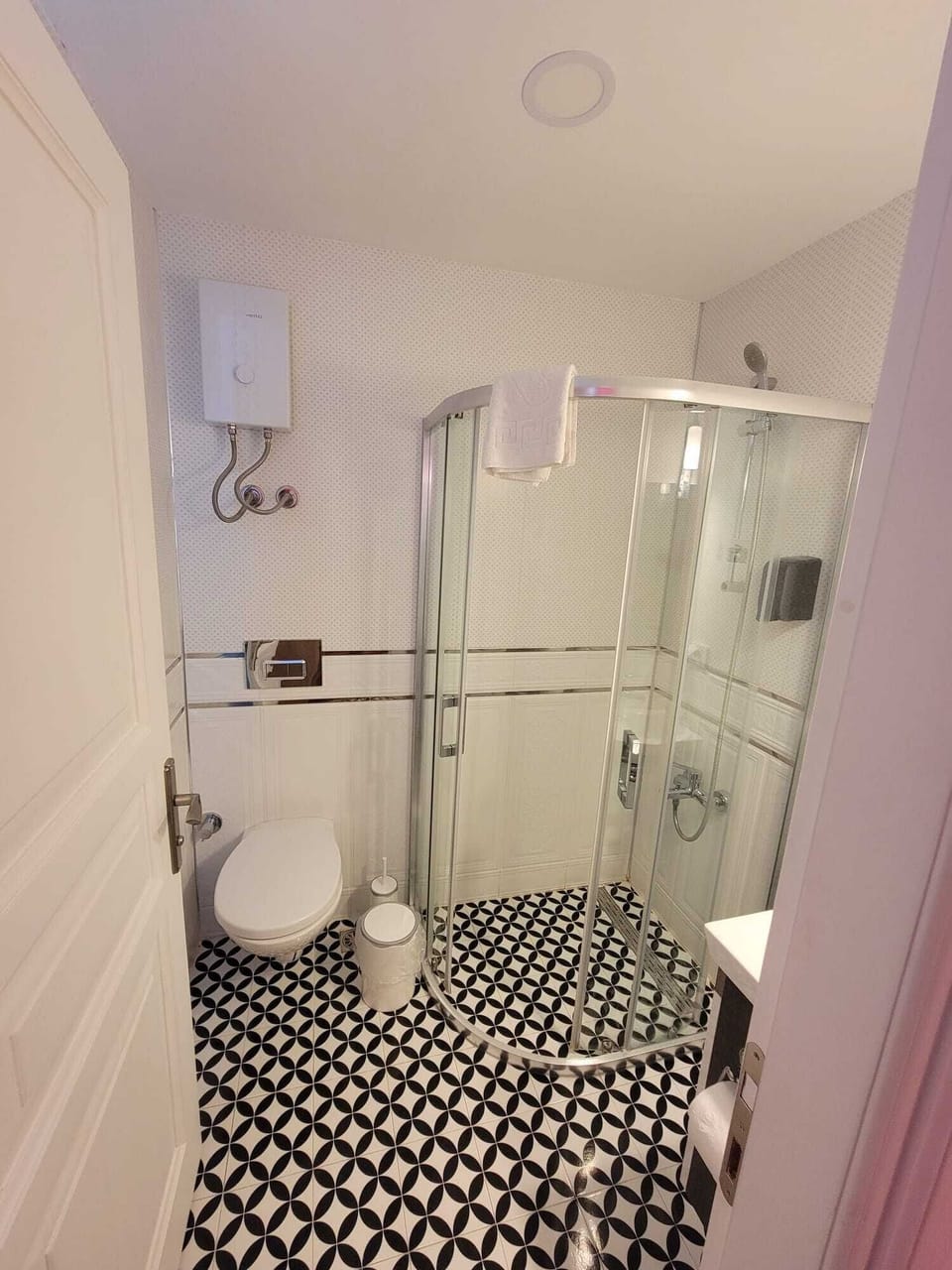 Shower, hair dryer, slippers, towels