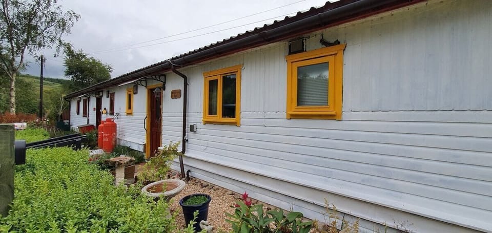 The cottage is the far one