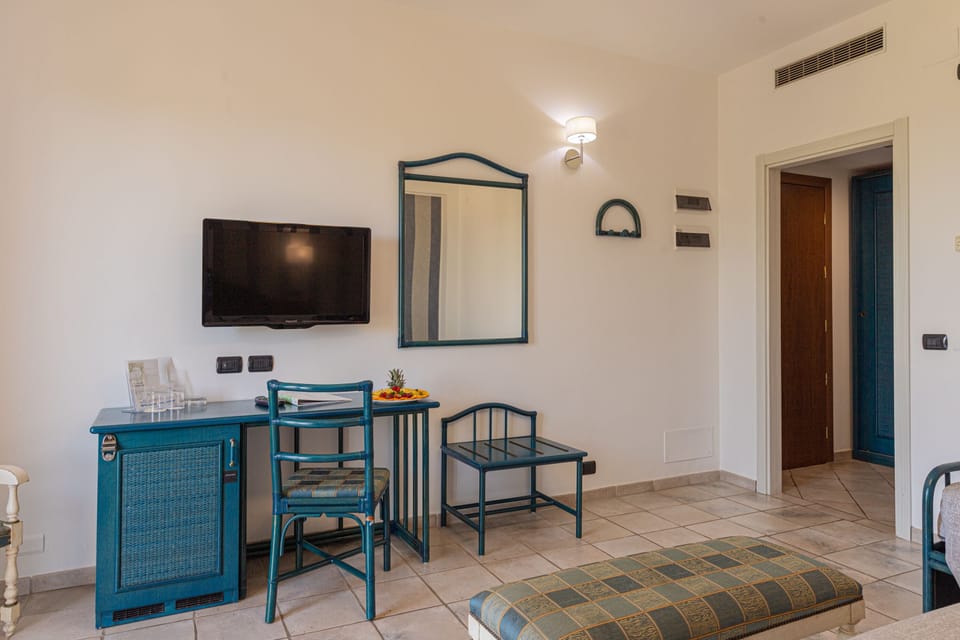 Superior Triple Room, Balcony, Sea View | Minibar, in-room safe, desk, laptop workspace