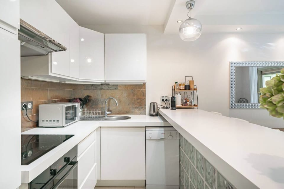 Fully equipped kitchen with all pots, pans, utensils, and spices you may need
