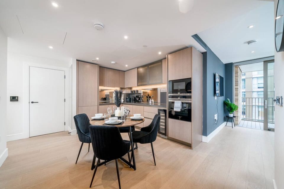 Modern kitchen with full amenities and a cozy dining area.