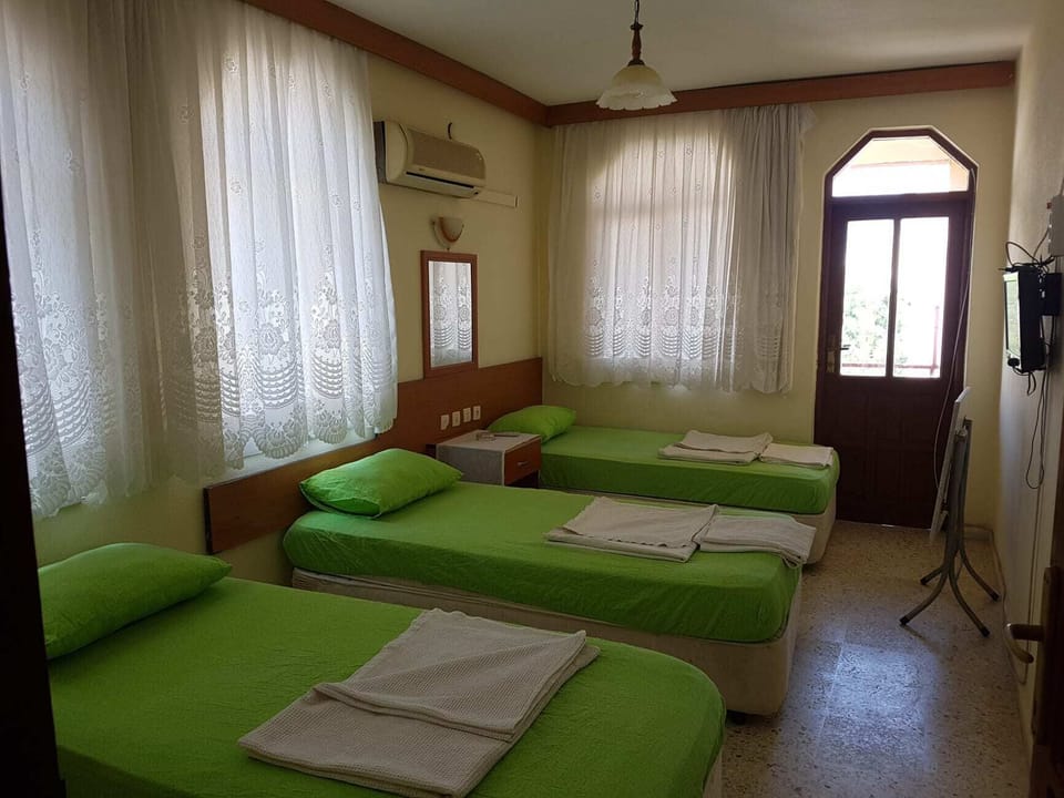 Standard Quadruple Room, Balcony, Garden View | Laptop workspace