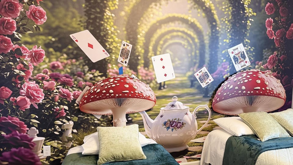 Whimsical Alice-themed bedroom with mushroom lamps and floating cards.