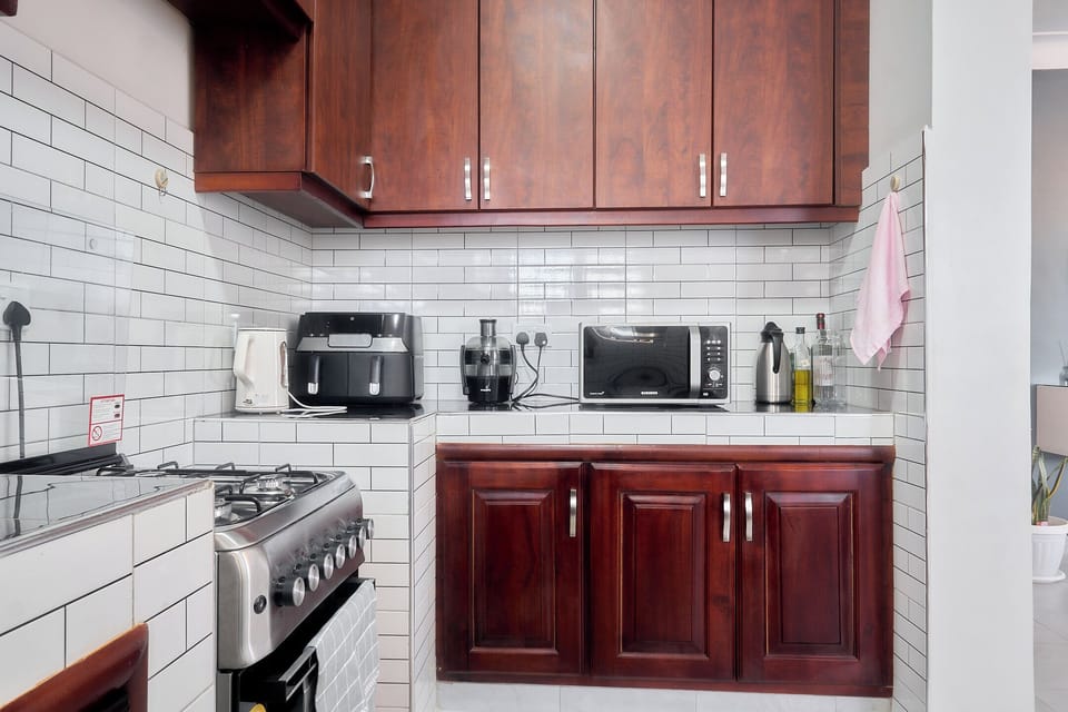 Economy Apartment, City View | Private kitchen | Fridge, microwave, oven, cookware/dishes/utensils