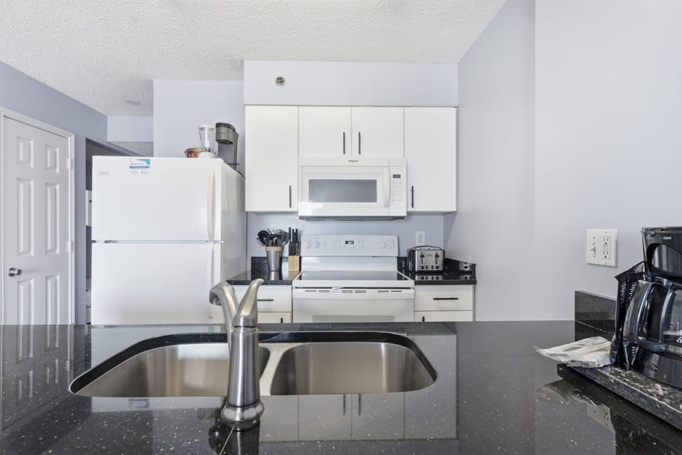 Signature Condo, Balcony, Beach View | Private kitchen | Fridge, microwave, oven, stovetop