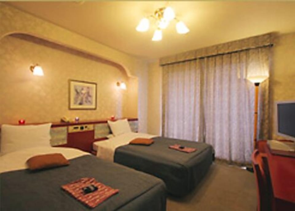 Twin Room, 2 Bedrooms | In-room safe, desk, WiFi, bed sheets