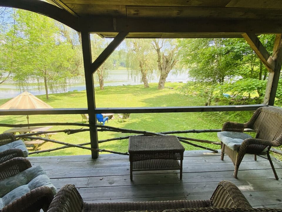 Savor stunning lake views from the porch, luxurious hot tub, cozy firepit, or manicured lawn. Enjoy the ideal backdrop for relaxation and unforgettable moments.
