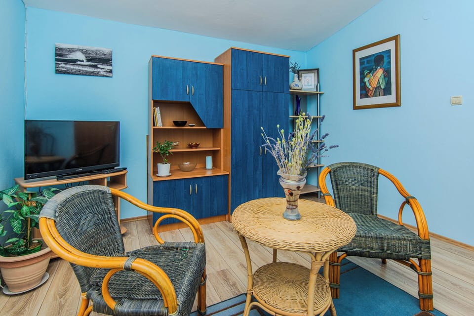 Standard Apartment, Balcony, Partial Sea View | Living area | 100-cm LCD TV with cable channels