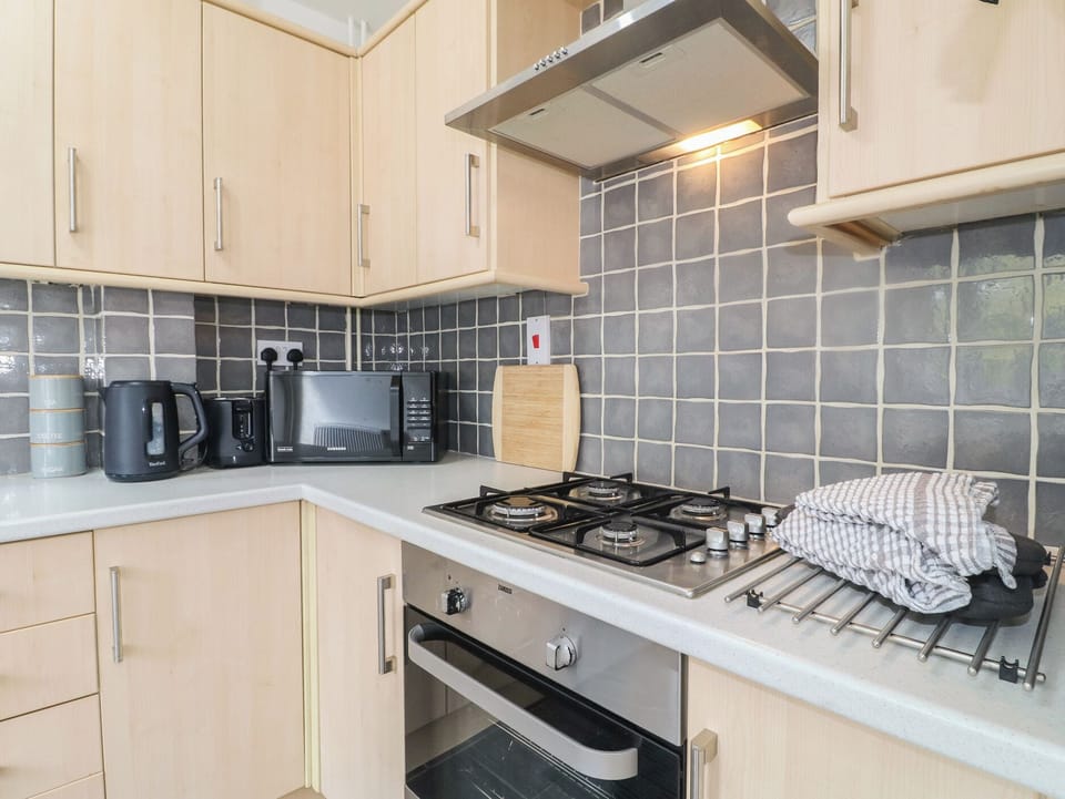 Fridge, microwave, cookware/dishes/utensils