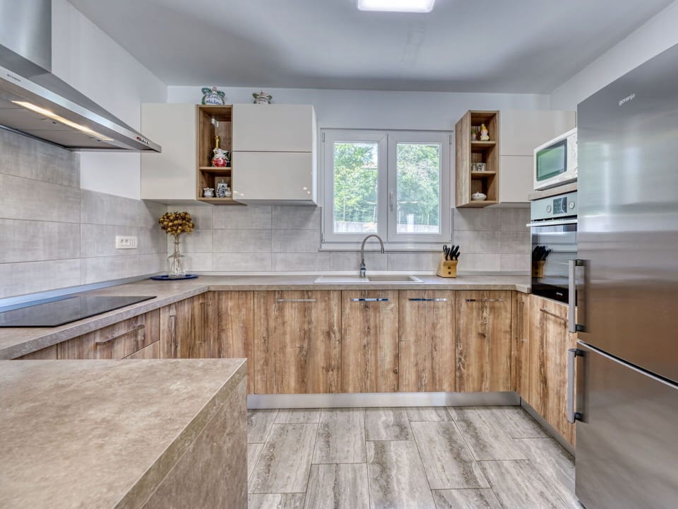Cabinetry, Kitchen, Flooring, Countertop, Wood, Major Appliance, Interior Design, Kitchen Appliance, Floor, Furniture