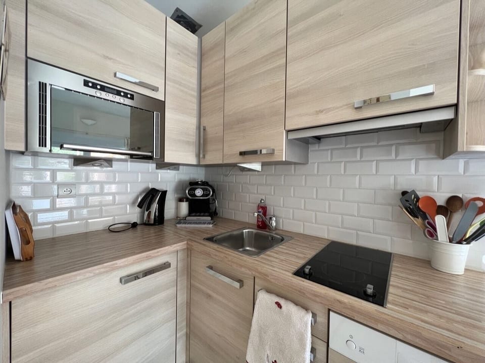 Deluxe Quadruple Room, Pool View | Private kitchen | Shared fridge