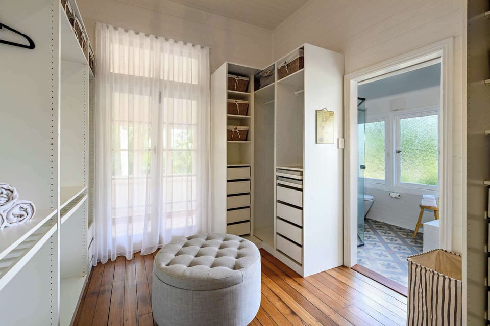 Spacious walk-in wardrobe with ample storage and natural light — a stylish, functional space to unpack and settle in with ease.