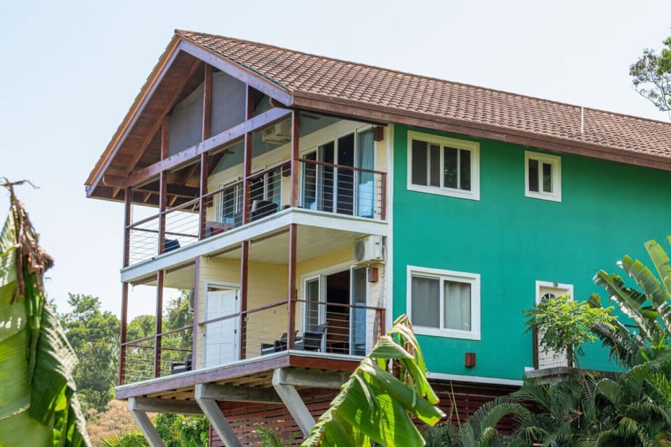 Incredible private balcony with sweeping views of the Caribbean Ocean over lush Roatan treetops—your serene perch above paradise.
