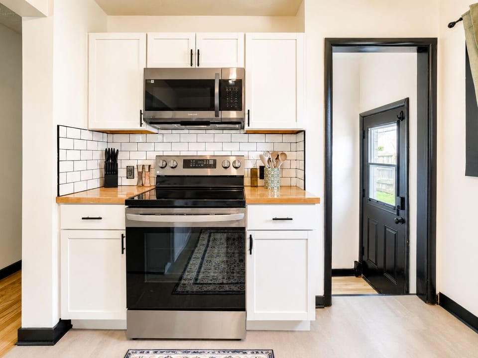 Bright modern kitchen with stainless appliances and stylish finishes