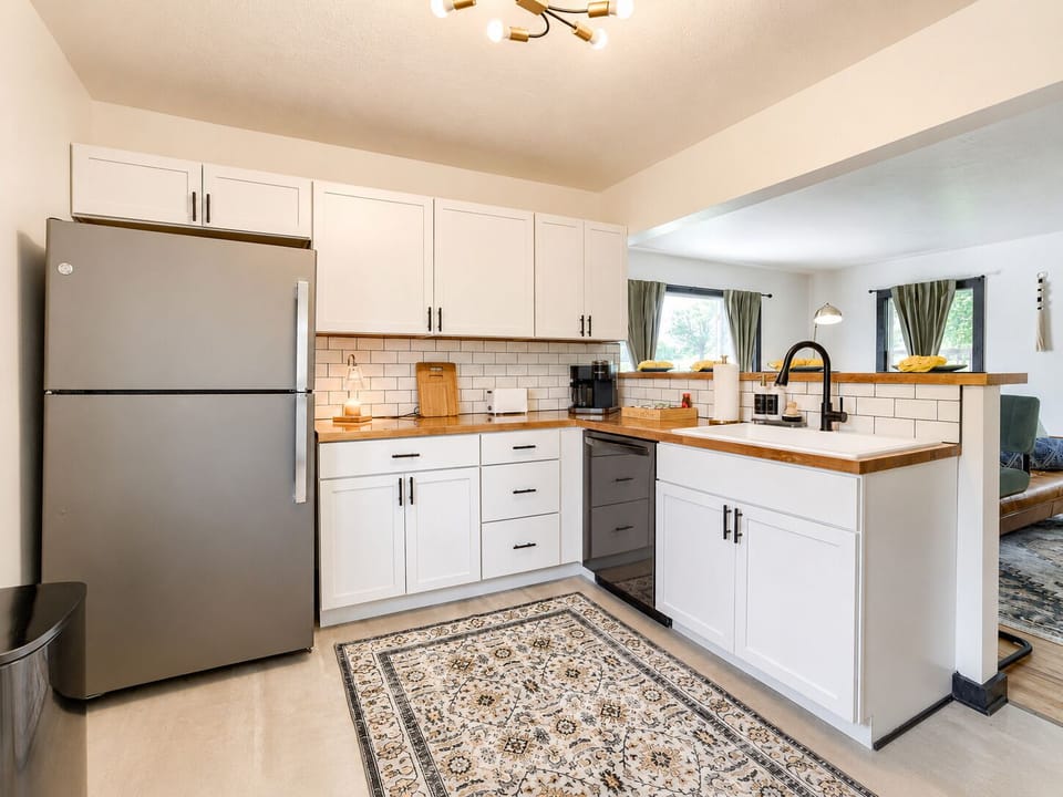 Bright modern kitchen with butcher-block counters and open layout