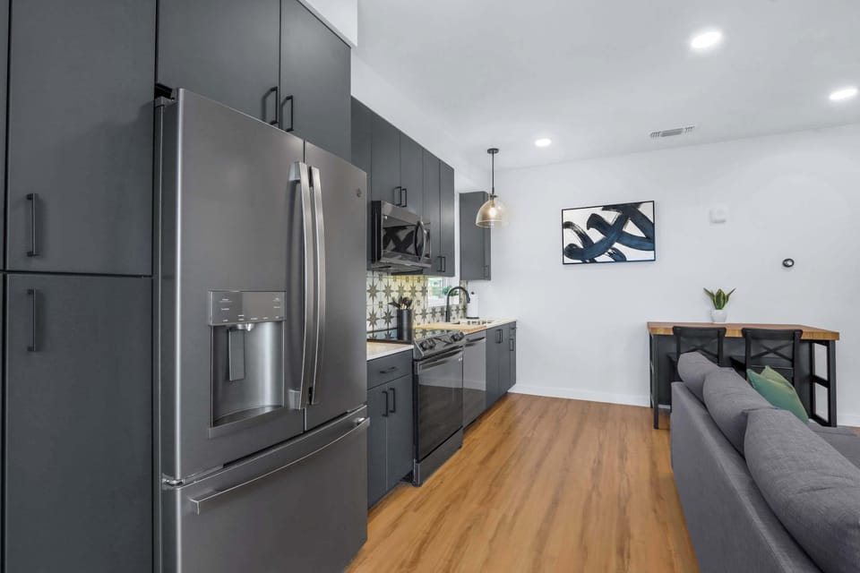 Condo, 1 Queen Bed with Sofa bed, Balcony (Creekside Modern) | Private kitchen | Fridge, microwave, oven, stovetop