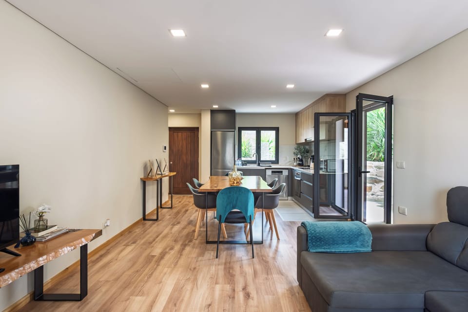 Apartment, River View | Living area | Flat-screen TV