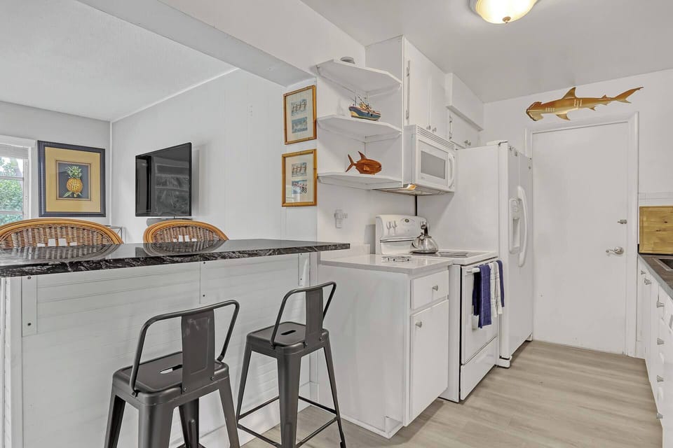 Fully equipped kitchen with bar seating--everything you need to cook & gather