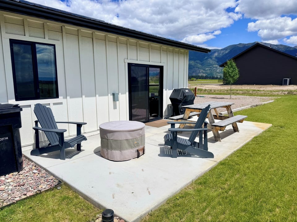 Private patio with fire pit, grill, and mountain views