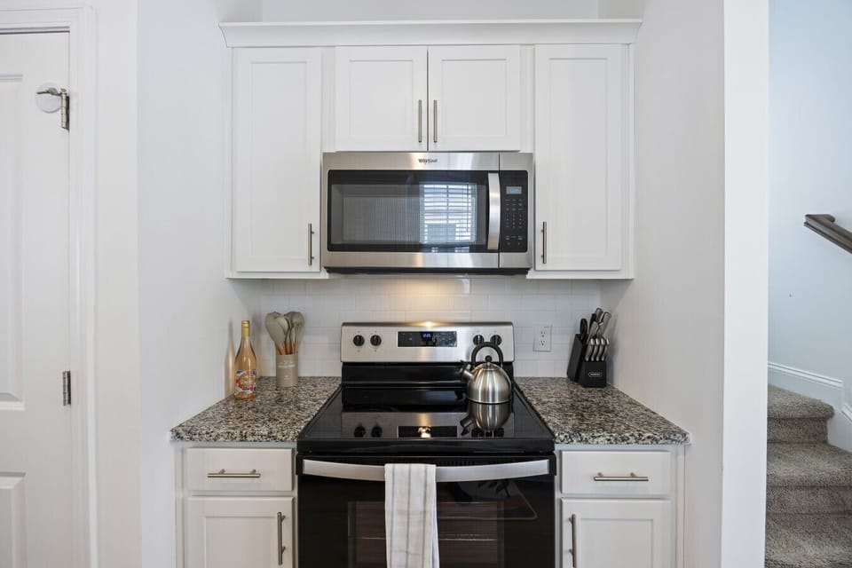 Stainless steel appliances in our fully stocked kitchen
