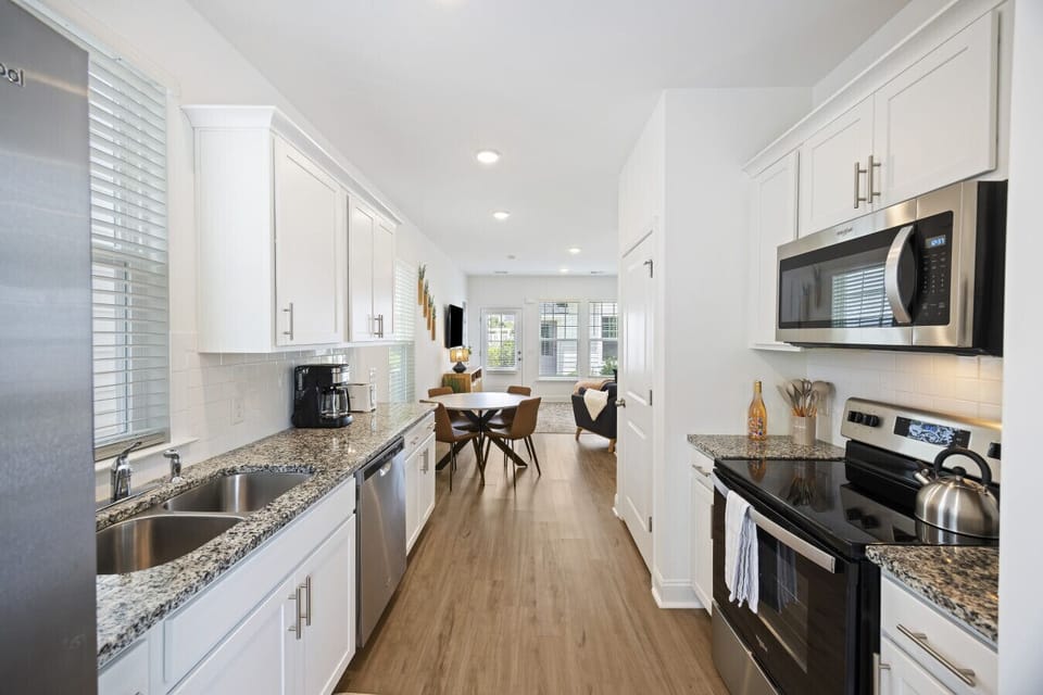 Fully stocked kitchen with stainless steep appliances