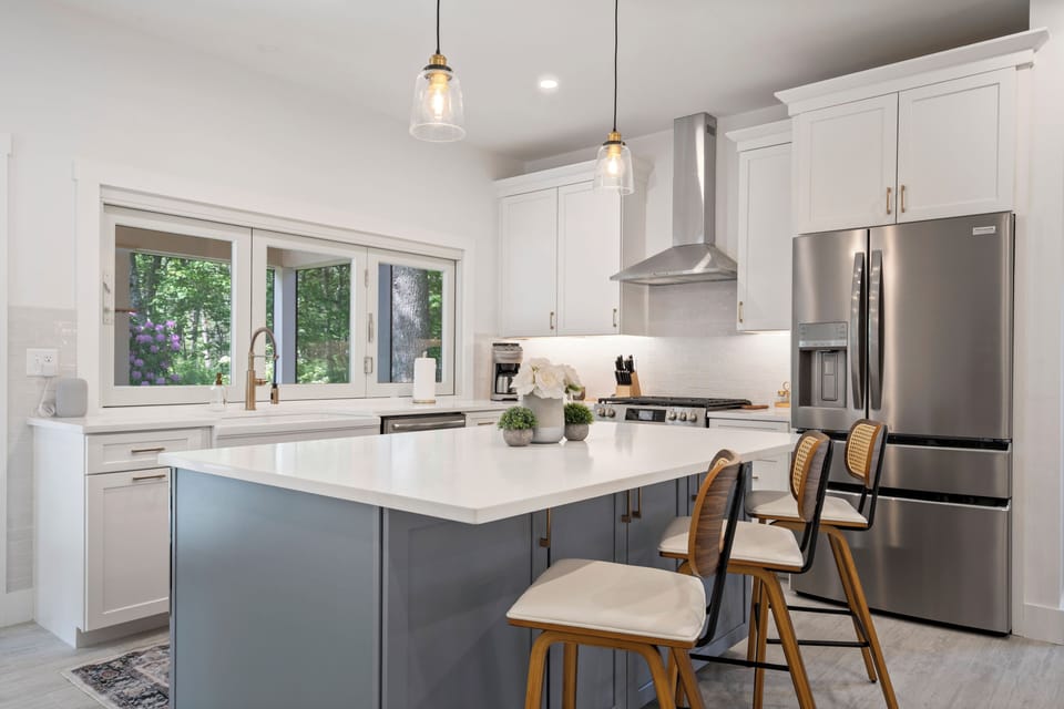 Elegant countertops and warm touches create a cozy kitchen