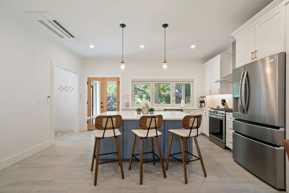Cozy winter kitchen with warm light and a calm, inviting coastal feel.