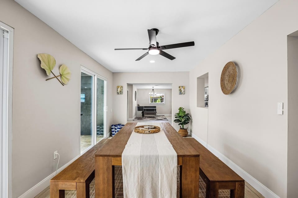 Enjoy vibrant meals at a stunning wooden table with natural light