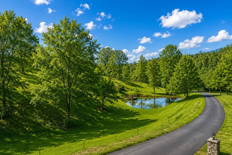 Enjoy a peaceful Smoky Mountain setting surrounded by greenery and a picturesque pond