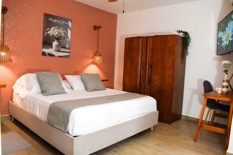 Family Triple Room, Garden View | In-room safe, desk, laptop workspace, blackout drapes