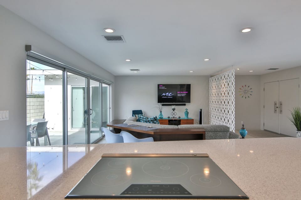 Seamless transition from kitchen to living and outdoor spaces, perfect for entertaining