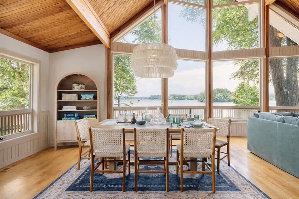 Indoor dining for 8-12 is provided with an expandable dining table and 2 bar stools in the kitchen. 