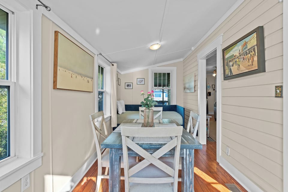 Indoor dining space with seating for four offers a cozy place for meals, game nights, and gathering with family and friends.