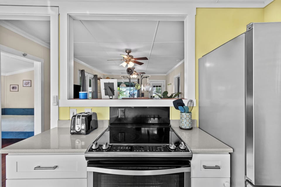 Updated kitchen fully stocked with cookware, coffee essentials, filtered water, and everything needed for cooking during your beach vacation