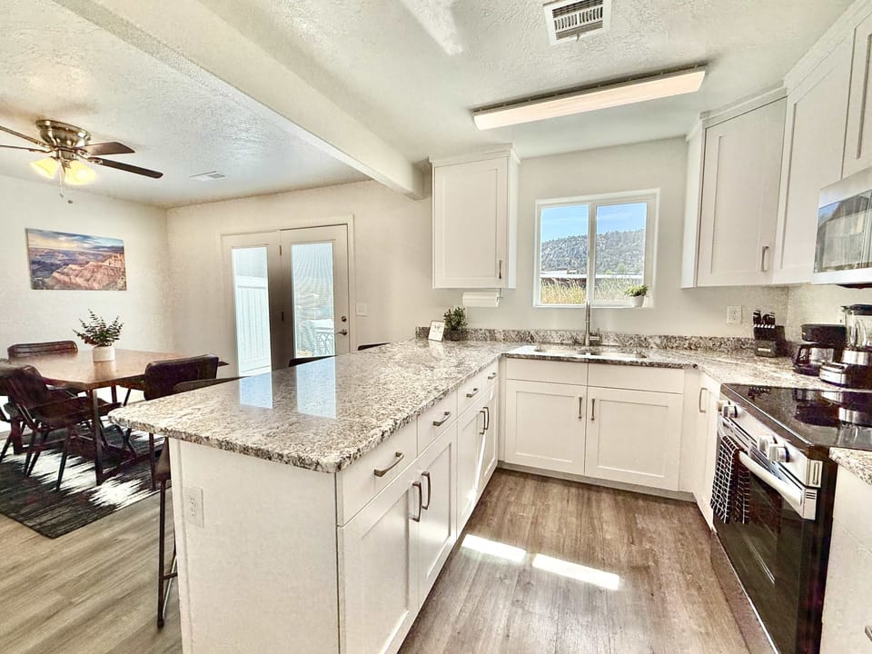 The kitchen and dinng area in Unit 1 is open to the living room which makes gathering with friends and family easy and fun