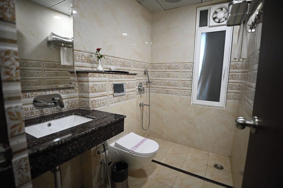 Shower, slippers, bidet, towels