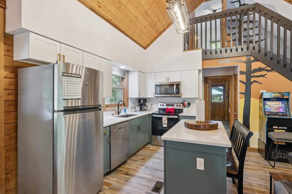 Fully equipped kitchen with stainless steel appliances.