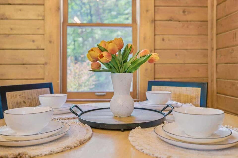 The dining area has amazing views and the perfect place setting. 