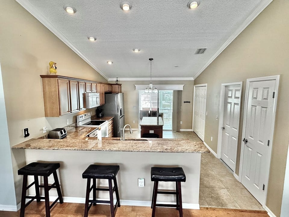 Along the right wall is the entry to the attached garage and the washer/dryer