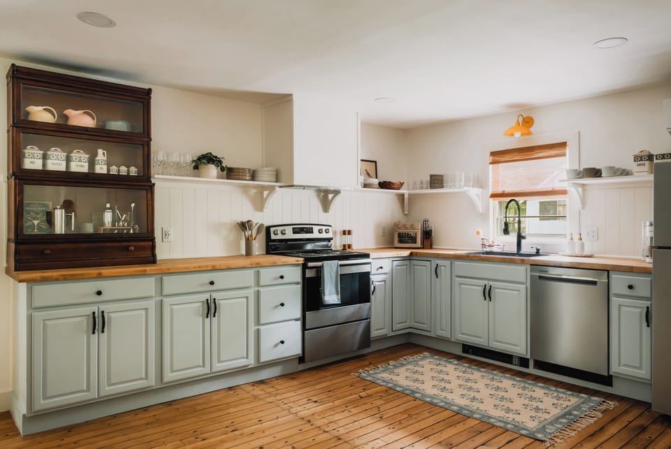 The spacious kitchen blends charm and functionality, offering plenty of room to cook, gather, and enjoy time together in a warm, inviting setting.