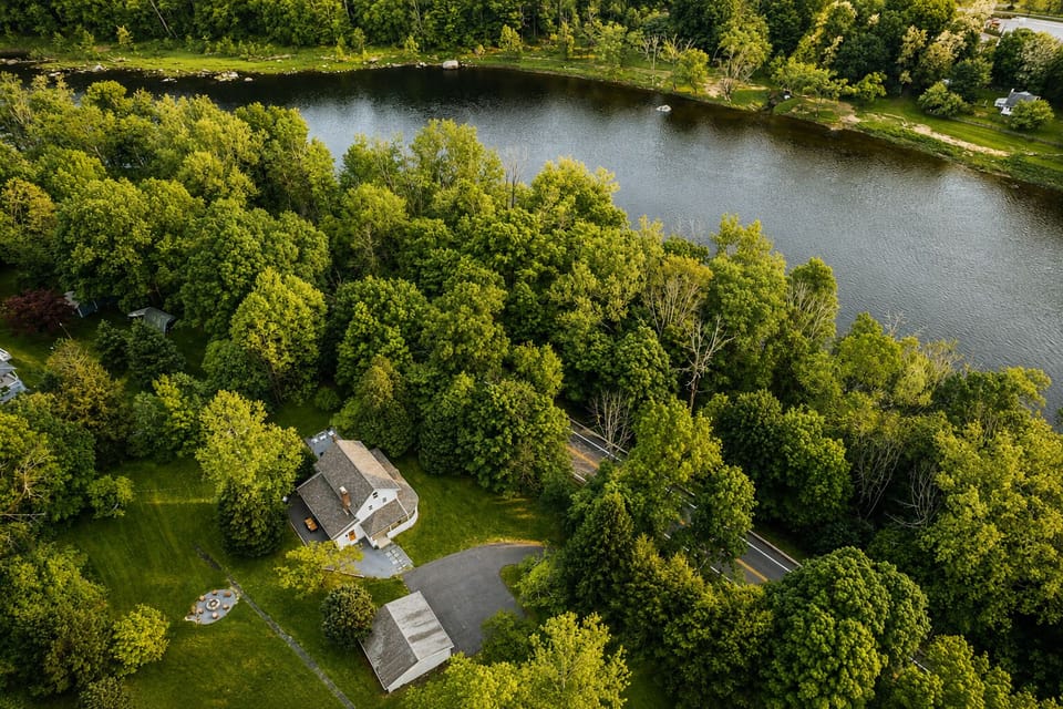 This home sits just steps from the water's edge with a big backyard to explore. Plenty of open lawn and tree cover give you space to wander during your stay.